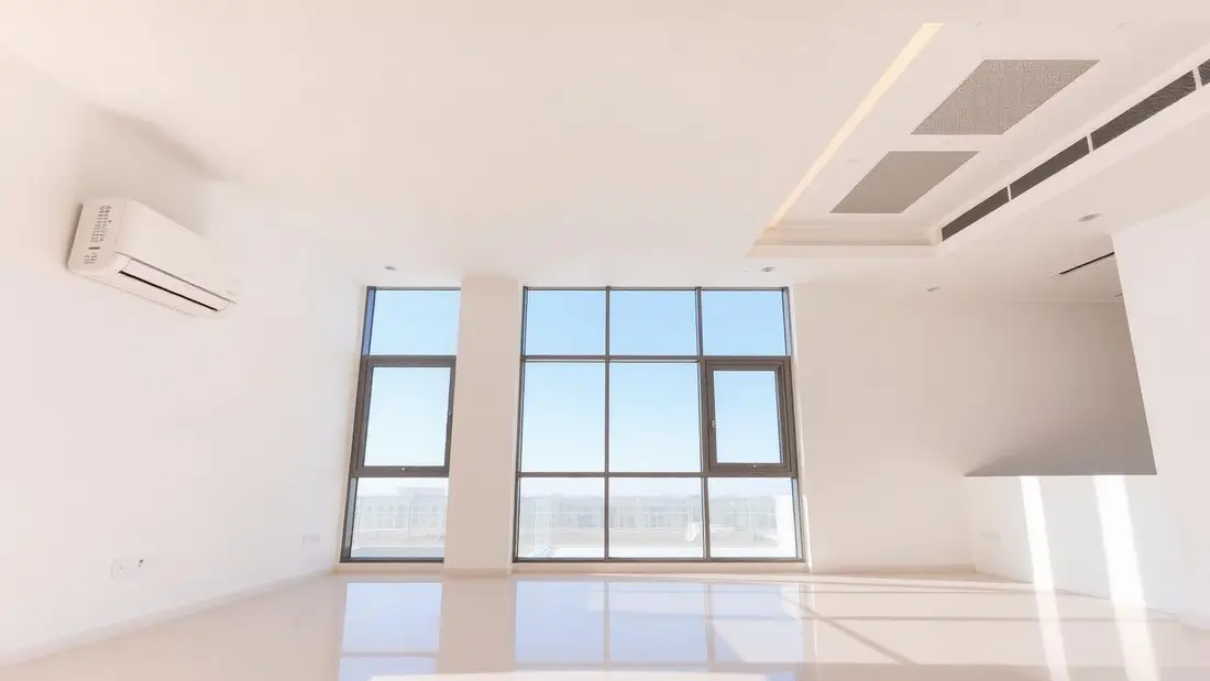 Modern split AC indoor unit mounted on a Dubai apartment wall